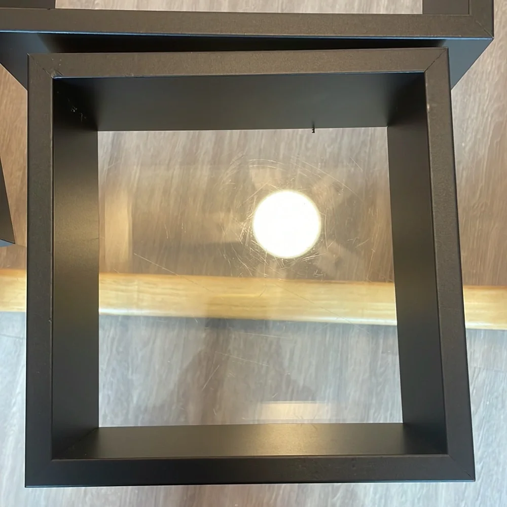 3 black shelving units